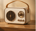 Retro Bluetooth speaker in beige, on a wooden shelf