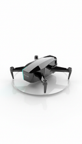 Adda quadcopter drone with a high-gloss grey finish and folded arms, resting on a reflective disc
